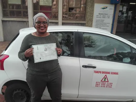 Happy student with driving certificate
